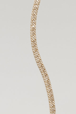 Roxy tennis bracelet, gold plated, close-up of the interlocking X settings and baguette cubic zirconia