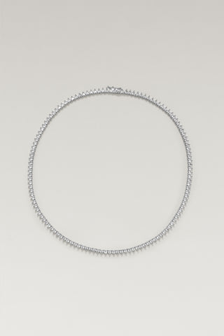 Vida tennis necklace, silver-tone, lying in a circle with the clasp at the top