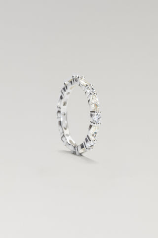 Aurelia eternity ring, silver-tone, standing on edge to show the scalloped stone line