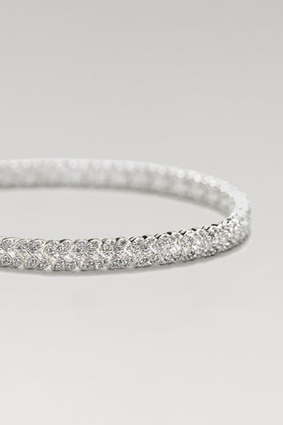 Roxy tennis bracelet, silver plated, angled close-up of the woven X-pattern cubic zirconia line