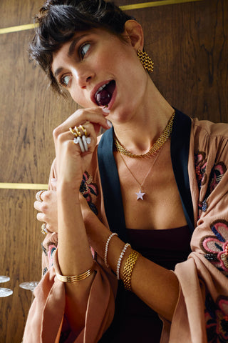 Statement Vivienne Necklace by One Dame Lane, worn at the collarbone with bold woven gold texture and contemporary styling.