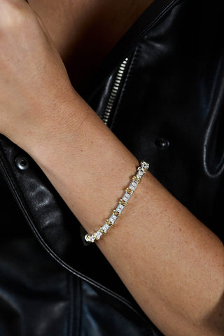 Renata bracelet, rhodium and gold plated, worn on the wrist over a black leather jacket