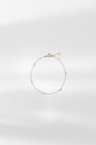 Elodie bracelet featuring delicate gold chain with subtle detailing