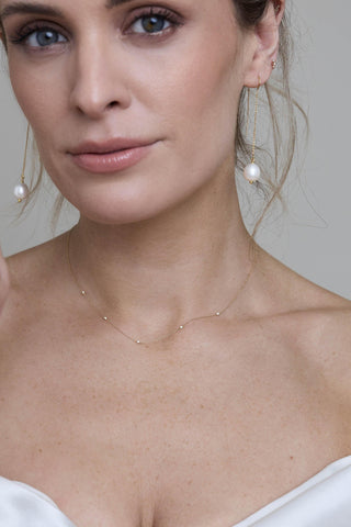 Elodie necklace worn with modern bridal styling and pearl earrings