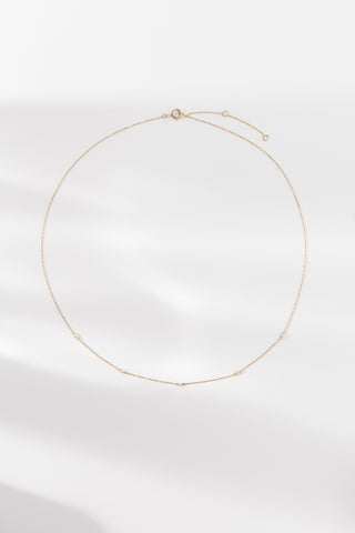 Elodie necklace featuring delicate gold chain with subtle detailing