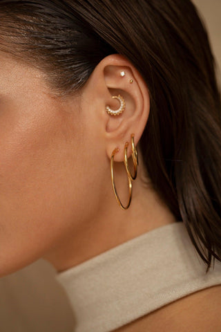 Estelle gold hoop earrings styled for everyday wear