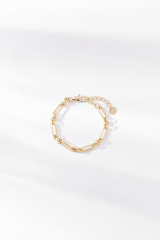 Jamie gold chain bracelet with elongated polished links on a white background