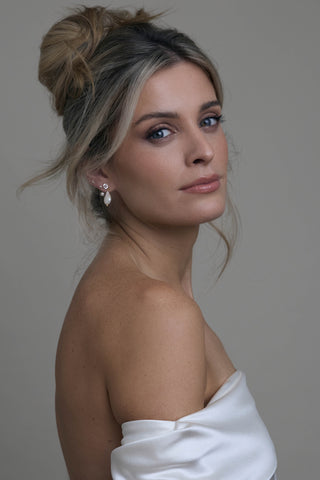 Margaux flat back earring styled with bridal jewelry in a wedding look