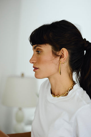 Minimalist gold Noa earrings lifestyle shot