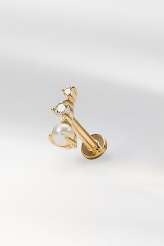 Odette flat back earring in gold featuring pearl and crystal detailing on a white background