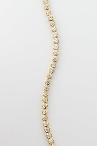 Close-up of Round Tennis Bracelet, featuring round-cut stones in a classic gold tennis bracelet design.