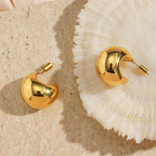 Close-up of Roz midi gold hoop earrings styled for everyday wear