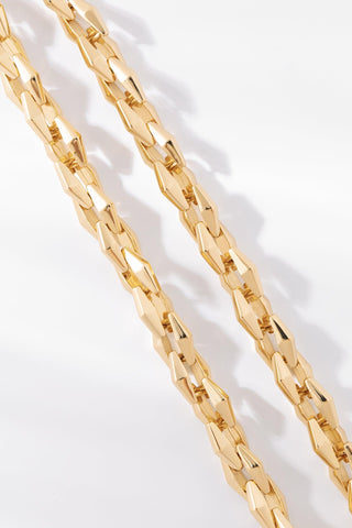 Close-up of Zara bracelet featuring polished elongated gold chain links