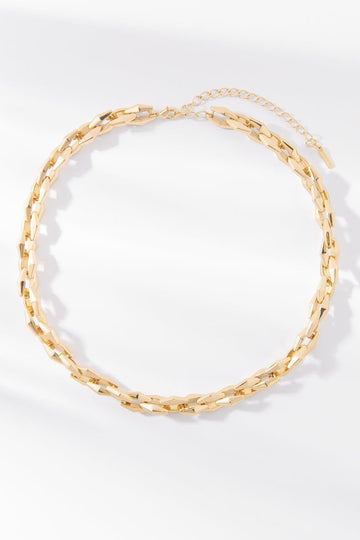 Zara gold chain necklace with elongated polished links on a white background